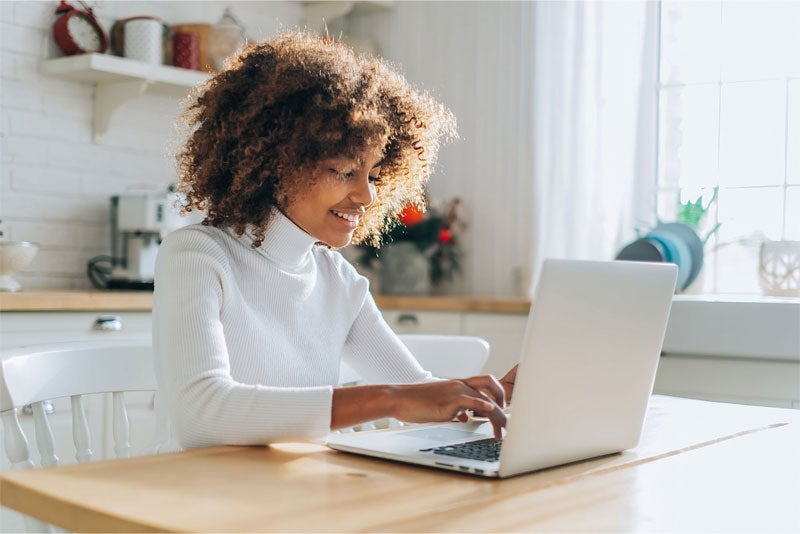 A woman customizing an offer at home.
